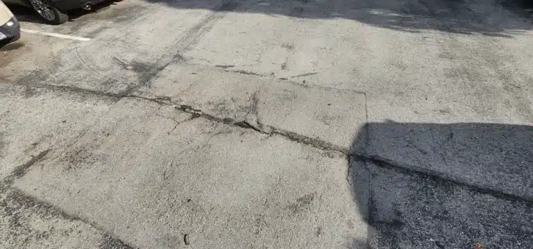 Cracked asphalt surface in parking lot