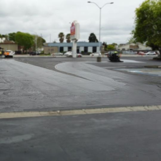 Understanding the Pavement Lifecycle for Commercial Properties 1 Freshly paved parking lot surface