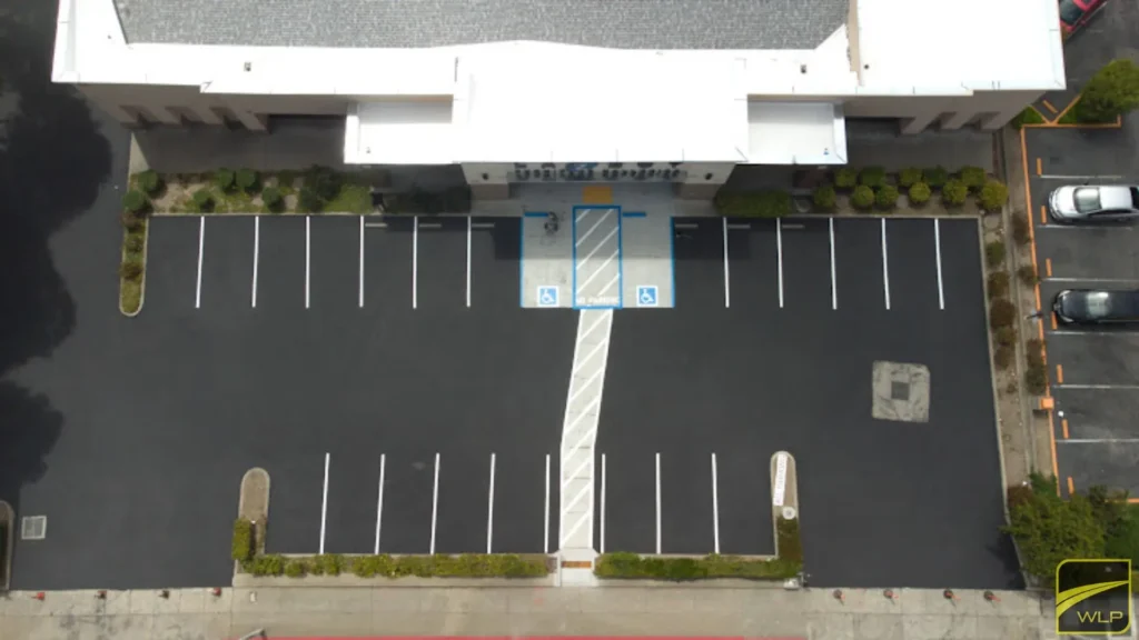 Commercial Paving 1 Aerial view of empty parking lot.