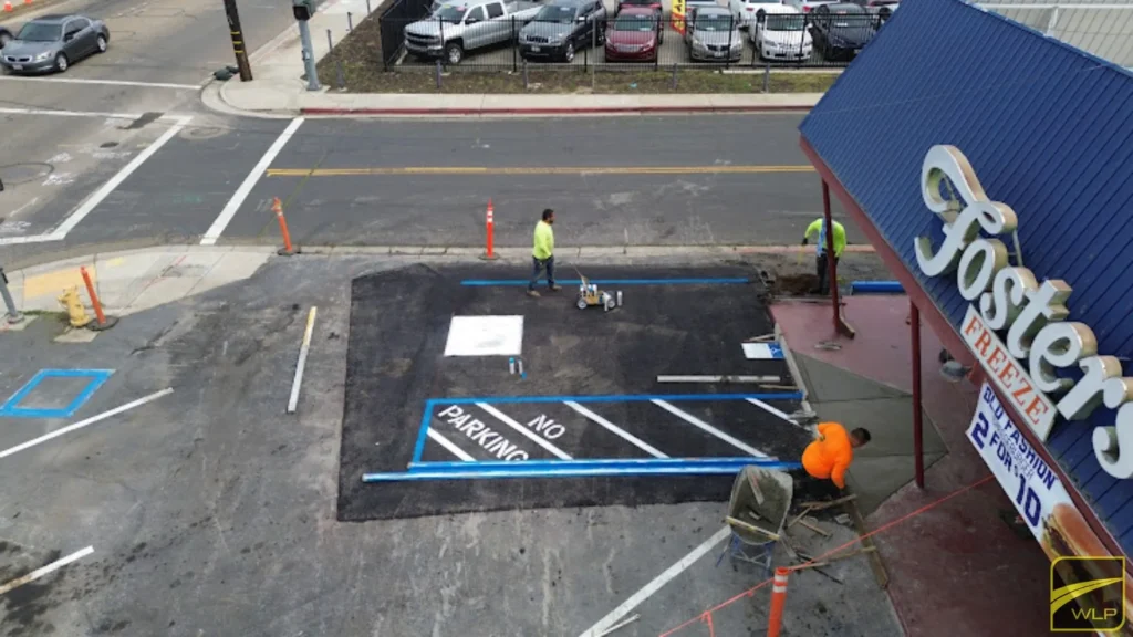 ADA Compliance 1 Workers painting parking lot lines