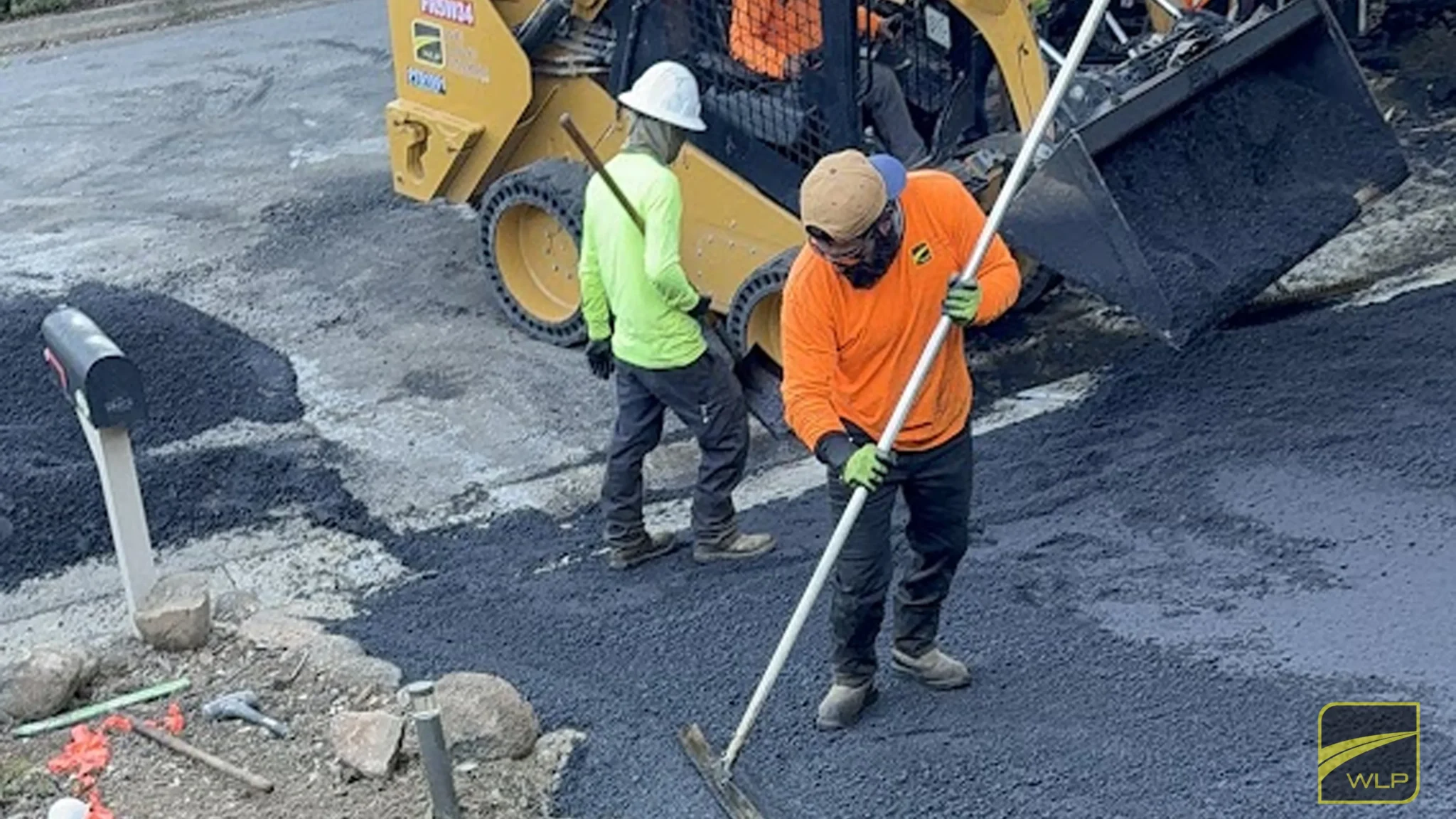 Yountville 1 Workers repairing a parking lot surface