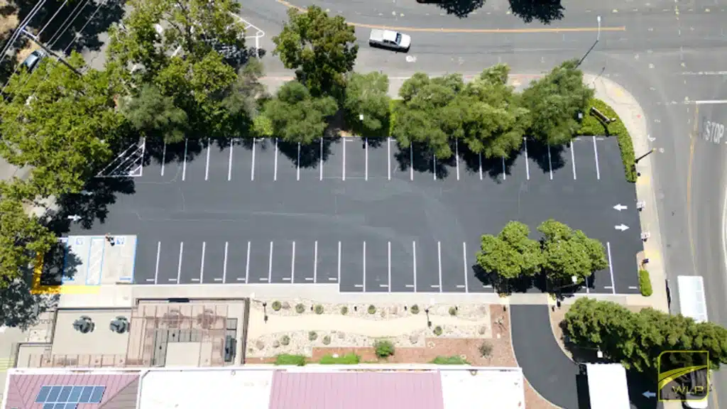 Aerial view of freshly striped parking lot Project by We Love Paving in Northern California, CA.