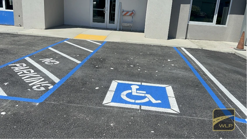 Healthcare ADA Accessibility 3 Newly painted handicap parking stall with blue accessibility symbol and access aisle markings. Project by We Love Paving in Northern California, CA.