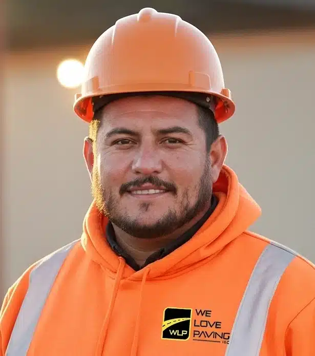 Construction worker in safety gear. Project by We Love Paving in Northern California, CA.
