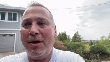 Home 2 A satisfied customer providing a video testimonial about his positive experience with We Love Paving services, filmed outdoors with a residential building in the background. Project by We Love Paving in Northern California, CA.