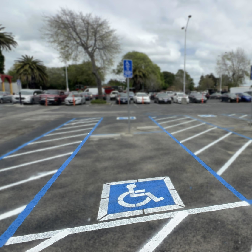 What Penalties Can Result From ADA Violations in a Parking Lot? 1 Handicapped parking space with signage