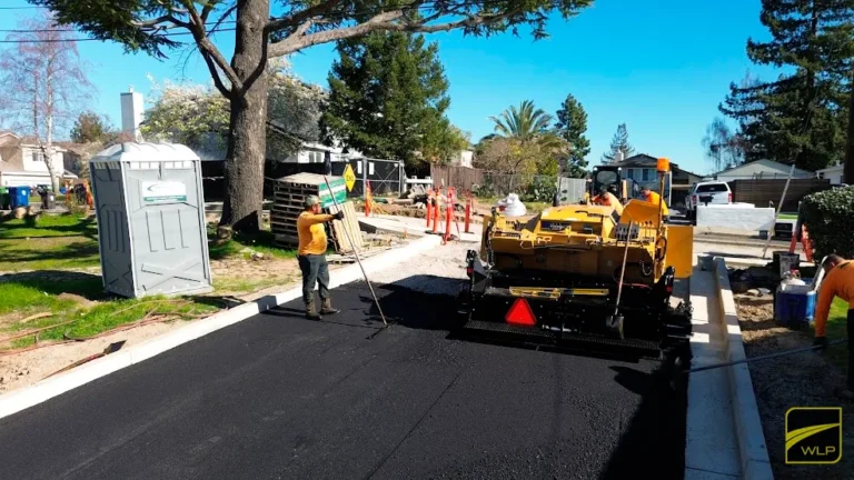 worker smoothing fresh asphalt lute castro valley, Ca